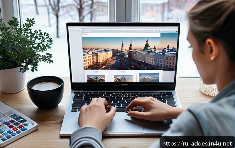 광고디자인과 관련된 소프트웨어 비교 - A modern creative workspace featuring a young Russian graphic designer working on a sleek laptop wit...
